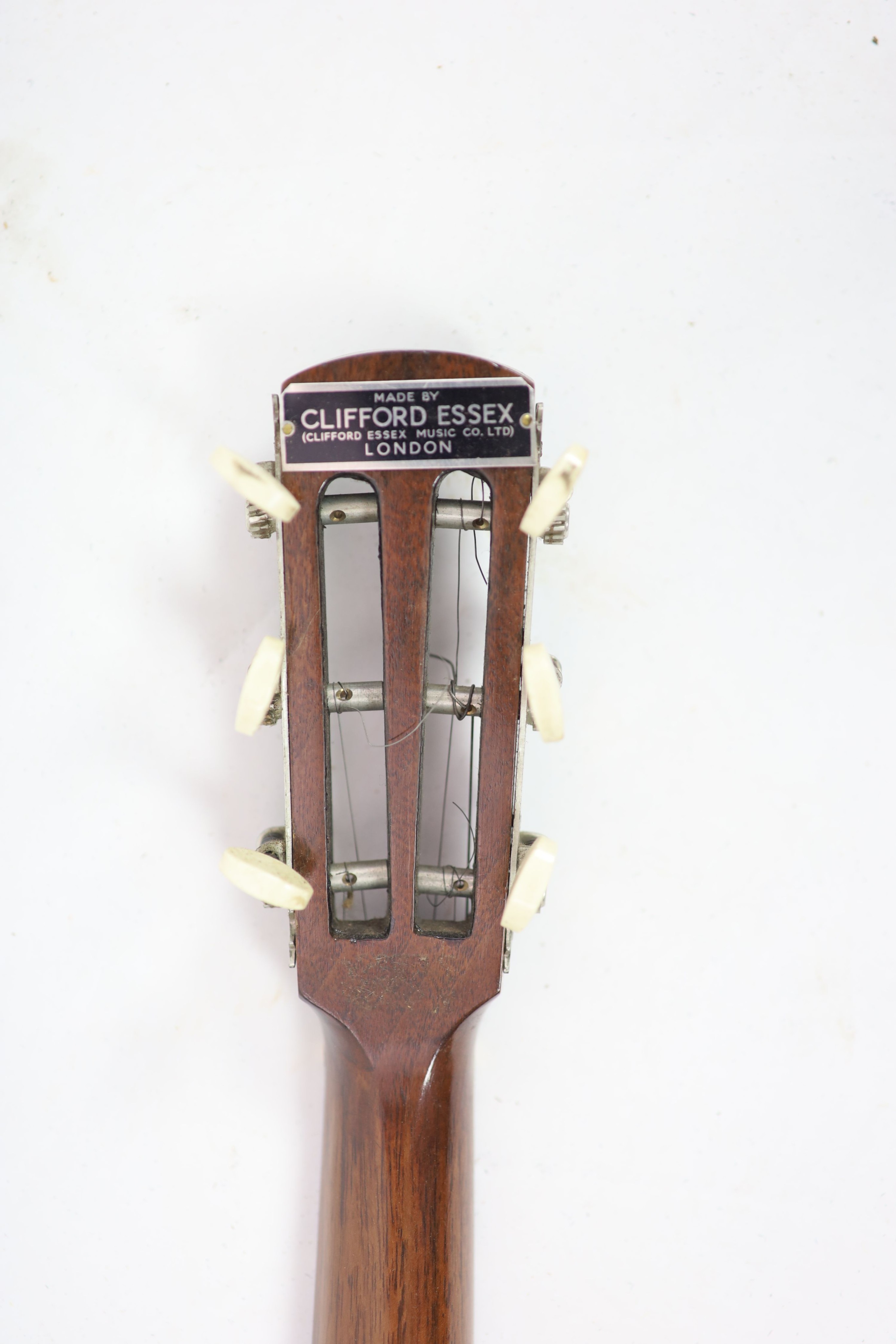 A Clifford Essex ebony mounted banjo, length 94cm, with distressed leather case